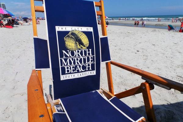 Beach chair on a sandy white beach
