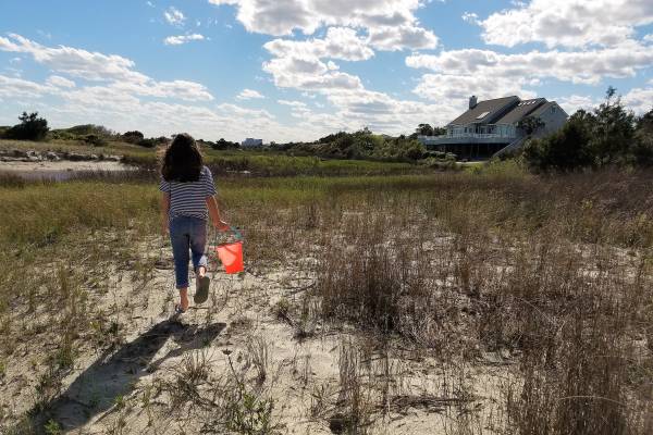 Girl walking with sand bucket in Myrtle Beach